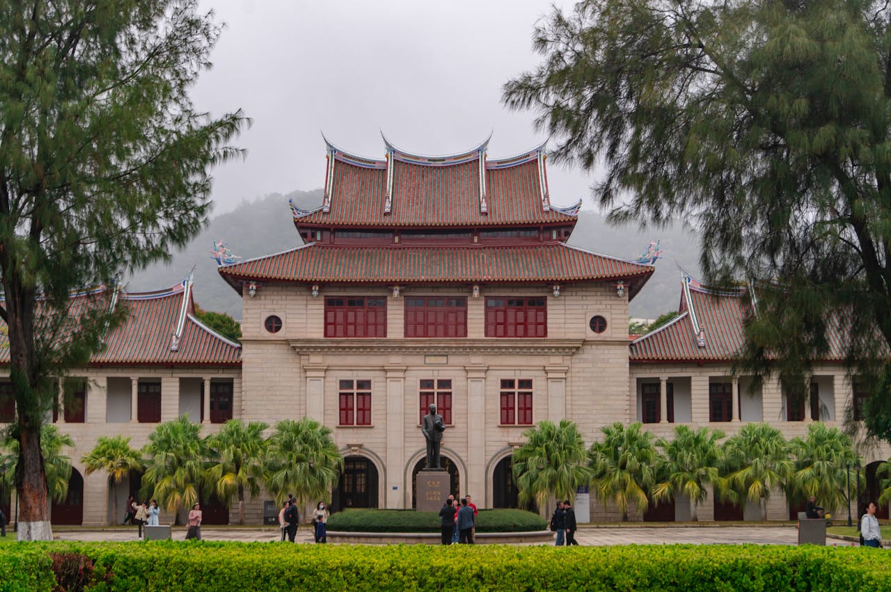 Scenic view of Xiamen University's main building with traditional Chinese architecture.